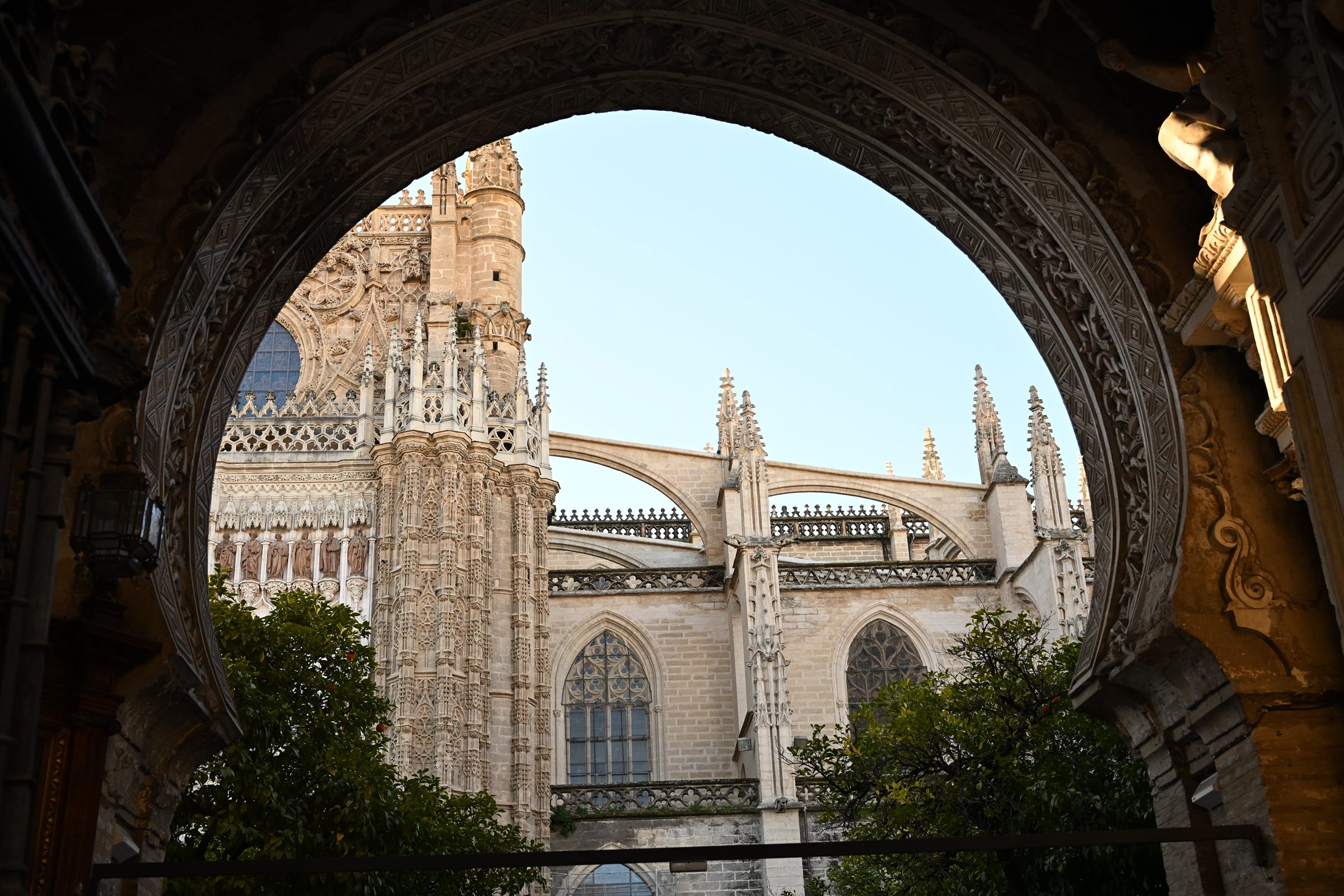 A cathedral seen through a stone archway